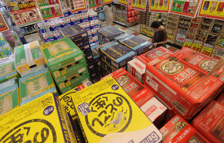 増税を前に、店内に積み上げられた第三のビールのケース=21日、東京都大田区のMEGAドン・キホーテ大森山王店